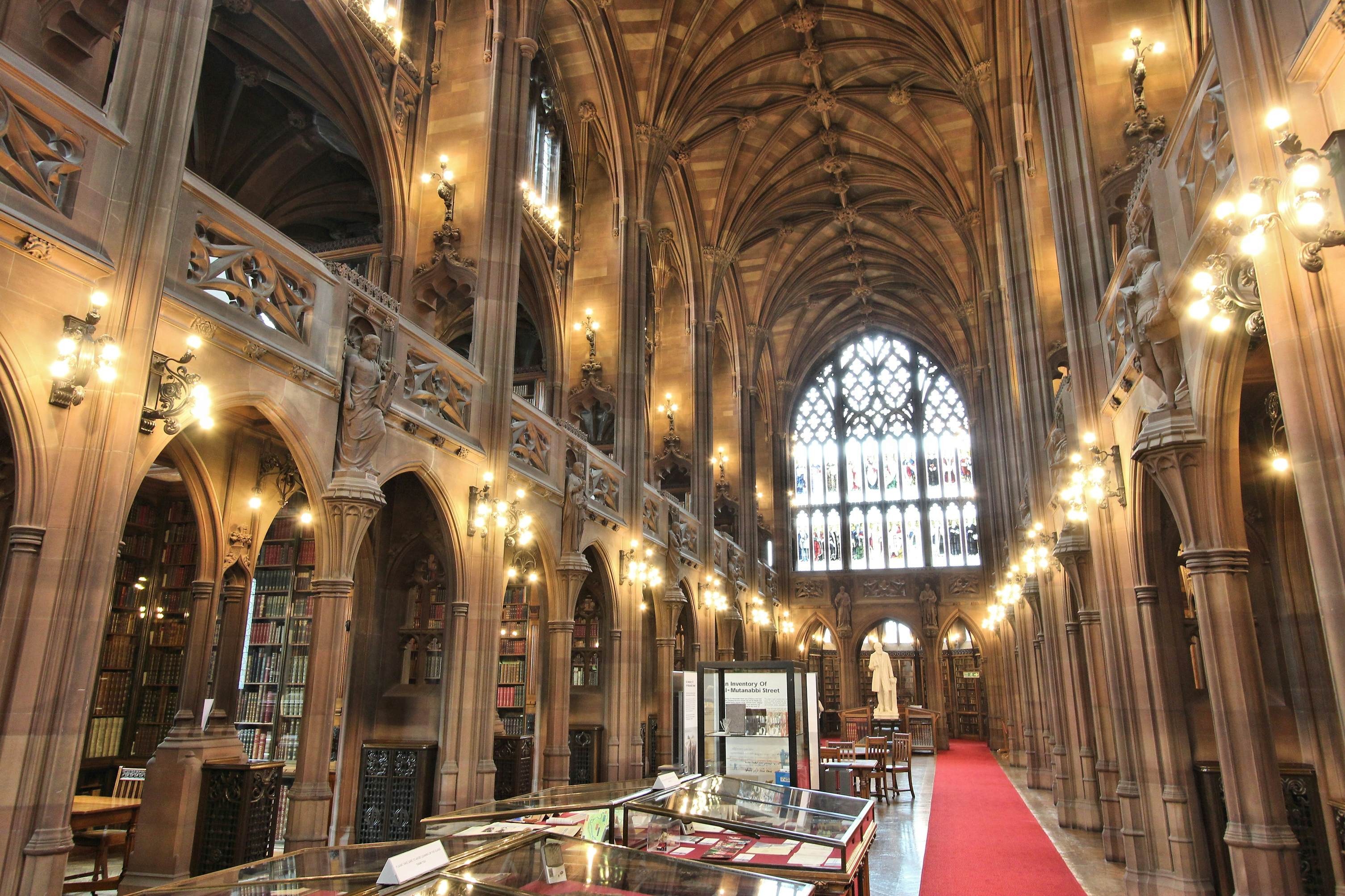 Manchester, United Kingdom - April 22, 2013: People visit John Rylands Library on April 22, 2013 in Manchester, UK. The library opened to public in 1900 and is a Grade I Listed building.